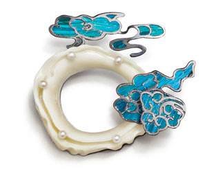 Future of the Industry 1st Place winner, Jiarui Lu of the Savannah College of Art and Design in Savannah, Georgia, created her Auspicious Cloud brooch in honor of the traditional ivory carving and kingfisher feather inlay that were popular in China's Ming and Qing dynasties, especially in the royal family of the Qing Dynasty (1644-1911). The iridescent blue feathers of kingfisher birds were used to create the art form, which is relatively unknown outside of China, and is rapidly disappearing. Due to ivory prohibitions, Jiarui Lu carved on tagua nut, which resembles elephant ivory, and incorporated sterling silver, copper, and freshwater pearls in her design.