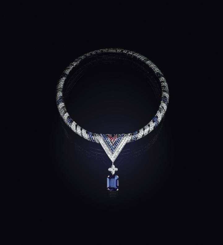 The Arrow is both a metaphor for Louis' journey and a literal interpretation of the V in his name, enhanced by exceptional craftsmanship and gemstones. At the centre of the necklace, the three-coloured V set with rubies, sapphires and diamonds is a nod to the personal emblem of Gaston-Louis Vuitton, the founder's grandson. It curls around the hollow of the neck like an ultra-precious scarf whose tip sparkles with a 2.61-carat D IF Type 2A LV Monogram Flower diamond and a sumptuous Sri Lankan sapphire with a perfect royal blue crystal weighing over 26 carats. With its elegant shape and rich diagonal pavé settings, this model – which may be worn in three different ways – inspired an entire jewellery set including a solitaire presenting an extremely rare velvety-blue, 18.62-carat sapphire.