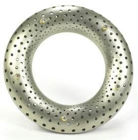 Gold Distinction 2nd Place winner Ezra Satok-Wolman of Atelier Hg & Co. Inc. in Ontario, Canada, used anticlastic raising techniques to create an 18k white gold torus brooch called Pythagoras' Cosmos to honor the ancient Greek mathematician, Pythagoras of Samos. The artist divided the torus mathematically to produce a hole pattern that mimics the phyllotaxis patterns observed in nature (phyllotaxis is the arrangement of leaves on a plant stem). 