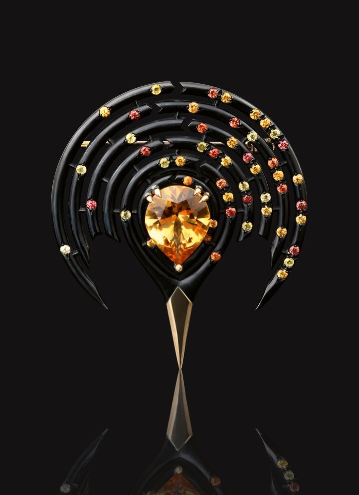 The Foraminifera brooch in black chrome-plated silver and 18k yellow gold, set with a custom-cut citrine from old stock. The sapphires encircling the citrine symbolise the destruction of plankton due to ocean acidification.