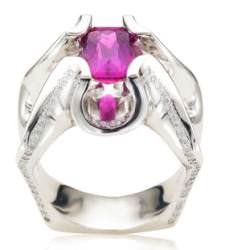 Platinum Distinction 2nd Place winner, Susan Drake of Spectrum Art & Jewelry inWilmington, North Carolina, crafted a Spanish Dancer ring that was inspired by the vivid hues and dramatic ruffled wings of the large and colorful tropical sea mollusk called Spanish Dancer nudibranch. The ring features an intense, natural-colored, fuchsia sapphire, captured between curving walls of platinum that are accented with lines of micro-pavéd one-point diamonds. The designer, a long-time scuba diver, drew from her undersea experiences to create the ring.