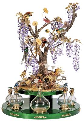 This decorative perfume bottle holder in gold, silver, enamel, and gemstones was one of many art objects created by Prologue.