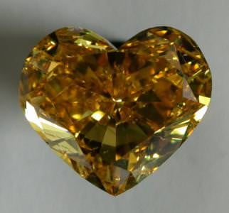 An 8.03-ct natural fancy vivid orangy yellow diamond, by Diarough.