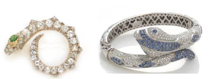 Diamond and demantoid garnet snake brooch with ruby eye & diamond and sapphire snake bangle bracelet by Leo Pizzo