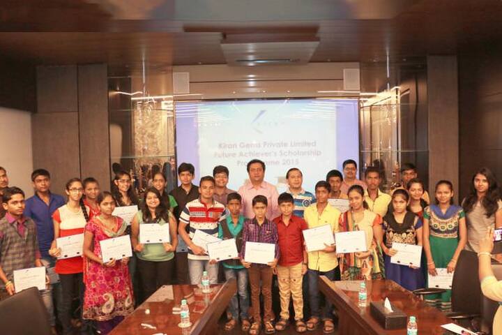 Kiran Gem's Director, Mr Dinesh Lakhani, with Scholarship Winners