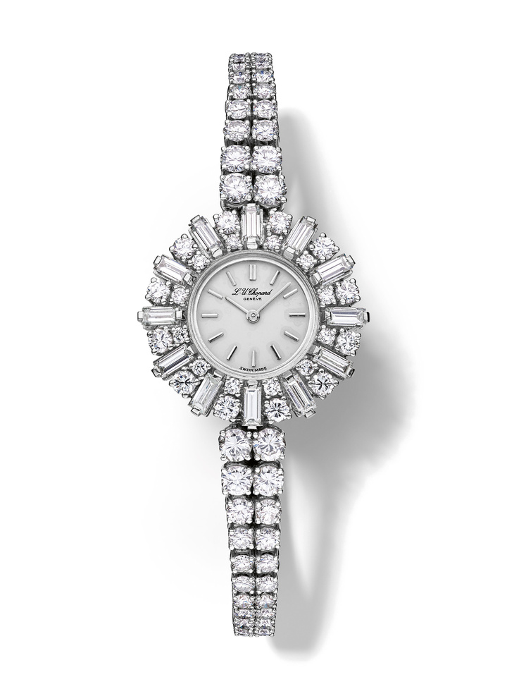 1964 - Ladies' wristwatch, white gold, silvered dial, articulated bracelet, 102 diamonds (8.32 carats), 12 baguette-cut diamonds (2.26 carats), mechanical movement. Featured in an advertisement from 1964 with the text “Maîtres de la montre-bijou, (“Masters of the jewellery watch”).